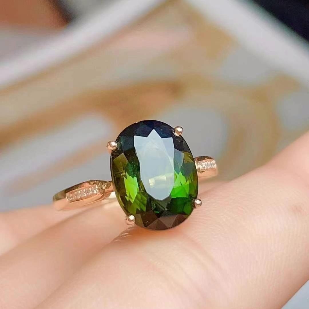 14k Gold 6.2 Ct Natural Tourmaline & Diamond Ring: Ref:230949183 // gold content:14k gold // ring size:7. 25us // // main gemstone:tourmaline // shape:oval // carat weight:6. 2ct // color:green // treatment:natural // // adjacent gemstone 2 :