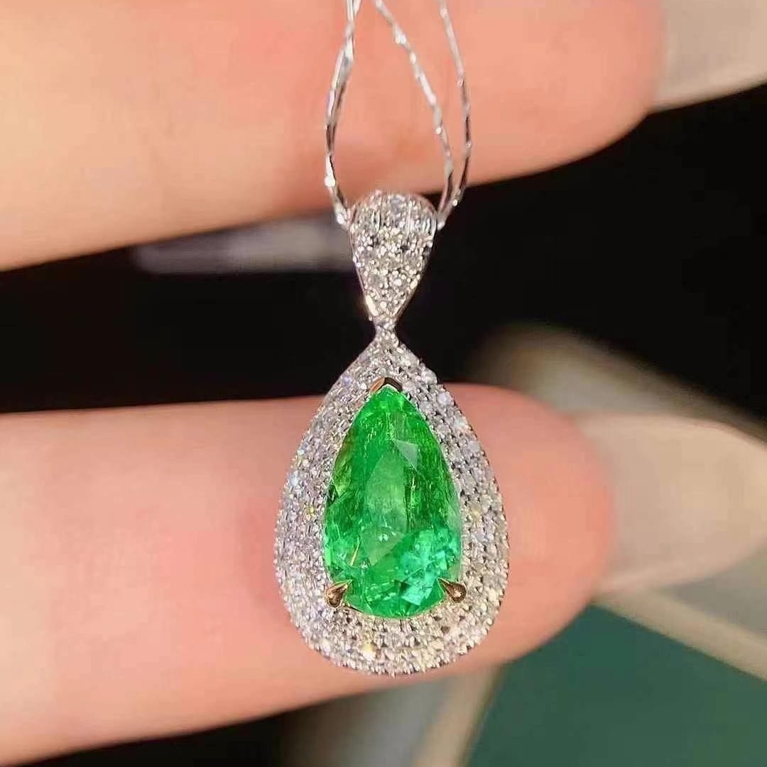 14k Gold 1.32 Ctw Natural Emerald & Diamond Pendant( Without Chain ): Ref:230949211 // gold content:14k gold // main gemstone:emerald // shape:pear // carat weight:1. 15ct // color:green // treatment:natural // // adjacent gemstone 2 : diamond // shape:round // carat we