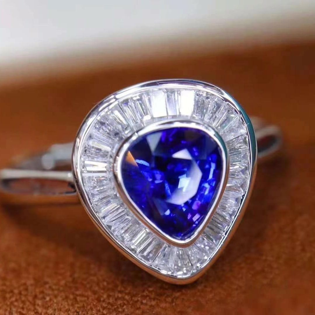 14k Gold 2.04 Ctw Natural Sapphire & Diamond Ring: Ref:230949231 // gold content:14k gold // ring size:7. 25us // // main gemstone:sapphire // shape:pear // carat weight:1. 69ct // color:royal blue // treatment:natural // // adjacent gemstone 2 : diam