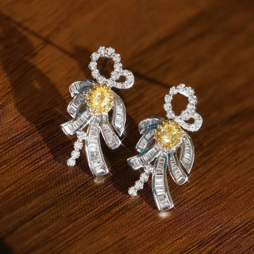 14k Gold 0.90 Ctw Natural Yellow Diamond & Diamond Earrings: Ref:230949259 // gold content:14k gold // main gemstone:yellow diamond // shape:oval // carat weight:0. 28ct // color:yellow // treatment:natural // // adjacent gemstone 2 : diamond //