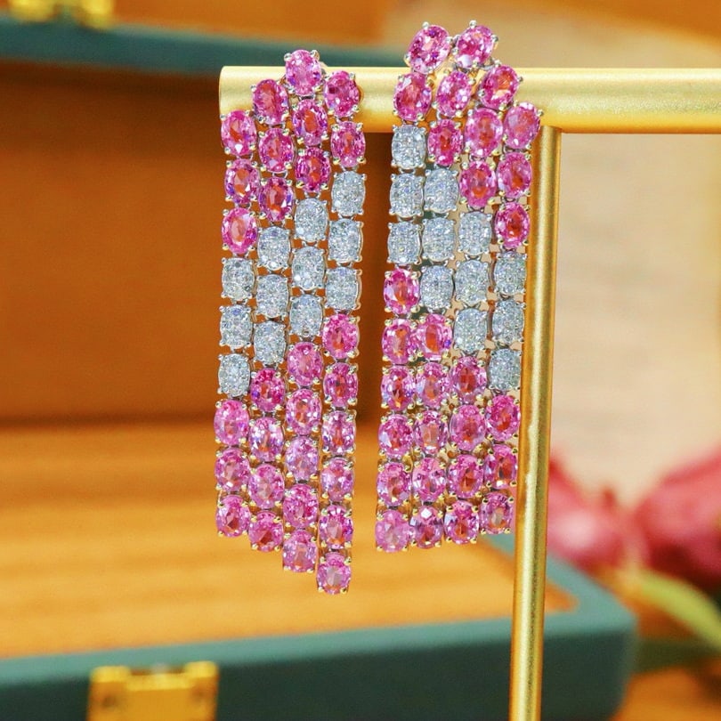 14k Gold 13.85 Ctw Natural Padparadscha Sapphire & Diamond Earrings: Ref:230950028 // gold content:14k gold // main gemstone:padparadscha sapphire // shape:oval // carat weight:13. 13ct // color:orangish pink // treatment:natural // // adjacent gemstone 2 : diamond