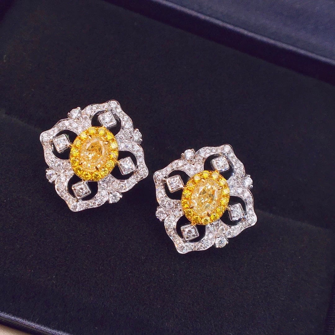14k Gold 1.13 Ctw Natural Yellow Diamond & Diamond Earrings: Ref:230950105 // gold content:14k gold // main gemstone:yellow diamond // shape:oval // carat weight:0. 61ct // color:yellow // treatment:natural // // adjacent gemstone 2 : diamond // shape:round //