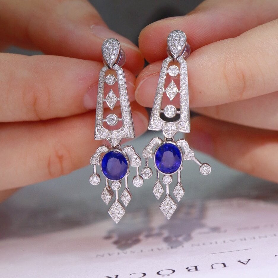 14k Gold 2.97 Ctw Natural Sapphire & Diamond Earrings: Ref:230950110 // gold content:14k gold // main gemstone:sapphire // shape:oval // carat weight:2. 1ct // color:royal blue // treatment:natural // // adjacent gemstone 2 : diamond // shape:round // car
