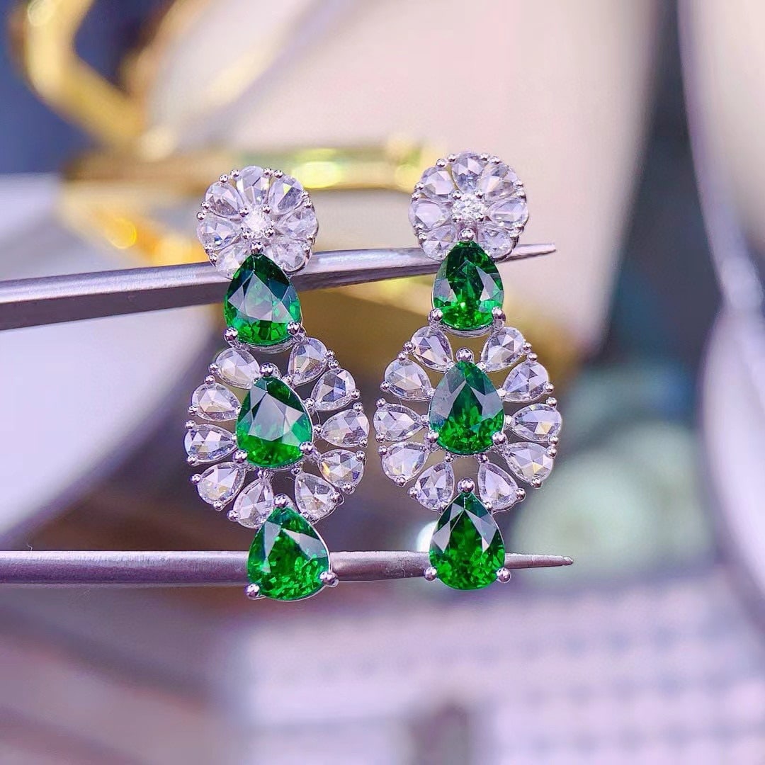 14k Gold 4.3 Ct Vivid Green Natural Tsavorite & Diamond Earrings: Ref:230950151 // gold content:14k gold // main gemstone:tsavorite // shape:pear // carat weight:4. 3ct // color:vivid green // treatment:natural // // adjacent gemstone 2 : diamond //