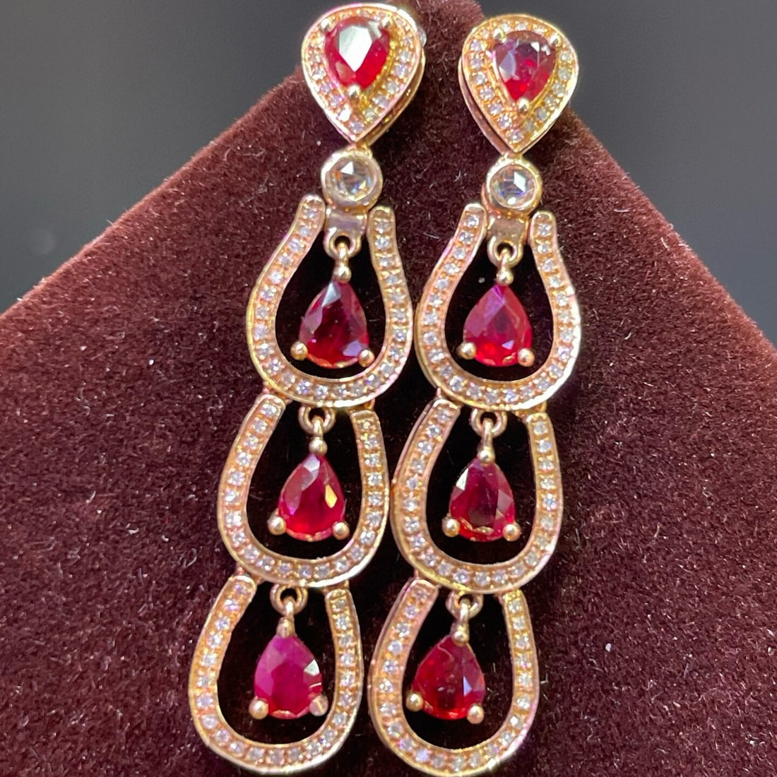 14k Gold 3.37 Ct Natural Ruby & Diamond & Sapphire Earrings: Ref:230950160 // gold content:14k gold // main gemstone:ruby // shape:pear // carat weight:3. 37ct // color:red // treatment:natural // // adjacent gemstone 2 : diamond // number of stones:172 //