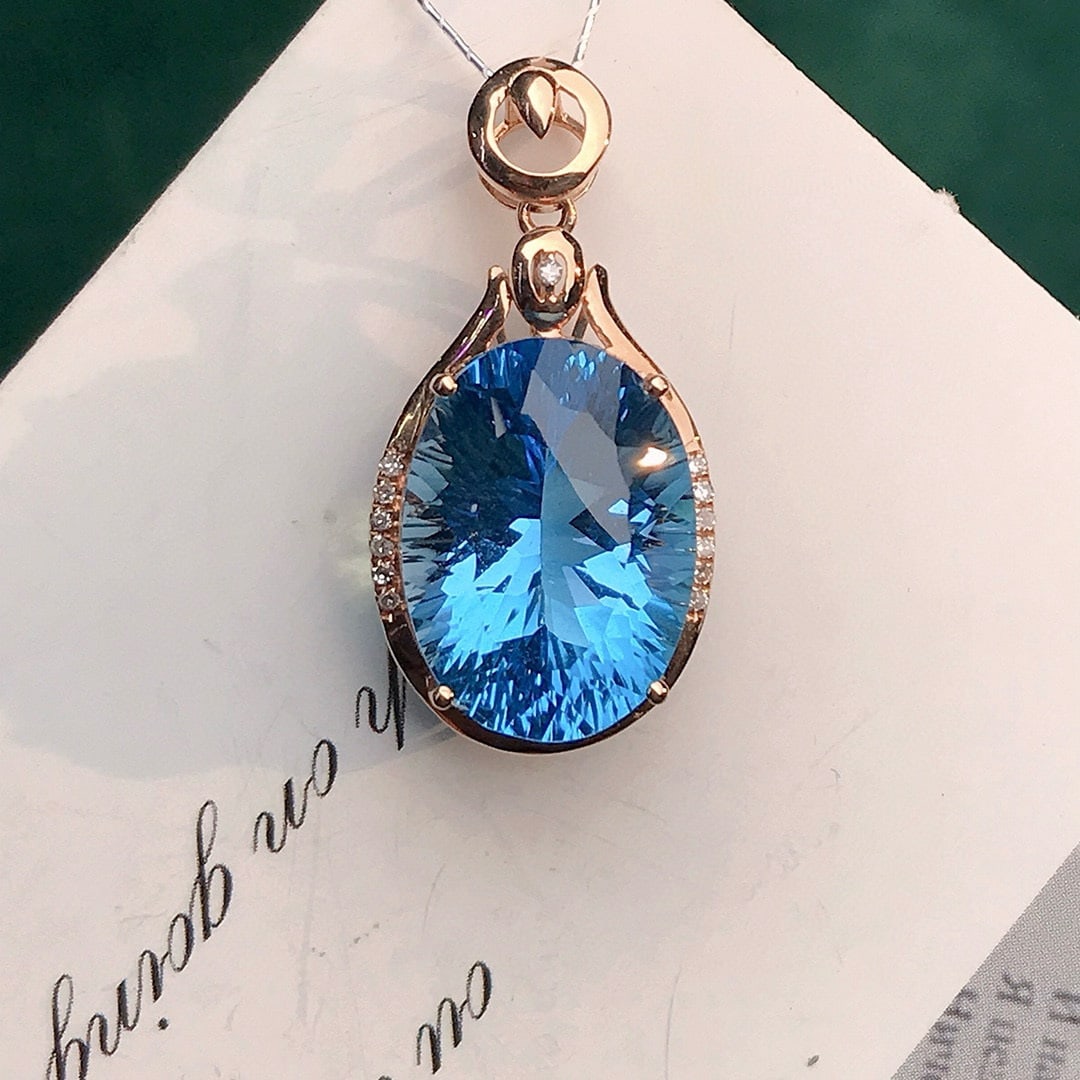 14k Gold 9.54 Ctw Natural Topaz & Diamond Pendant( Without Chain ): Ref:230950408 // gold content:14k gold // main gemstone:topaz // shape:oval // carat weight:9. 5ct // color:blue // treatment:natural // // adjacent gemstone 2 : diamond // number of stones:13 //