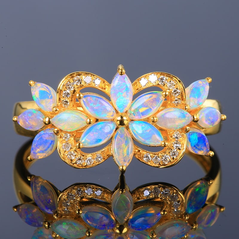 14k Gold 0.56 Ctw Natural Opal & Diamond Ring: Ref:230951003 // gold content:14k gold // ring size:7. 25us // // main gemstone:opal // shape:marquise // carat weight:0. 49ct // color:white // treatment:natural // // adjacent gemstone 2 : diamond /