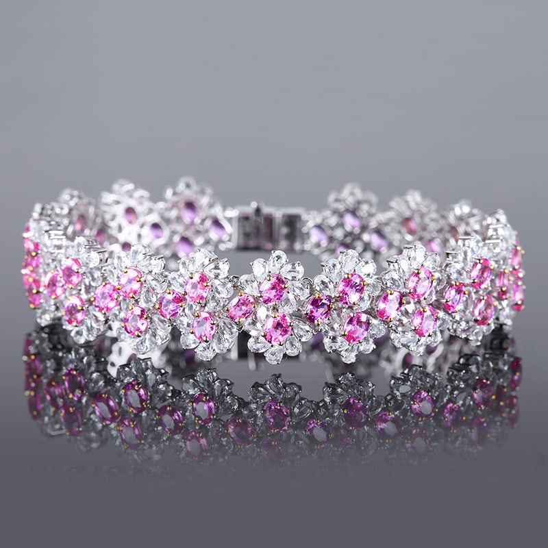 14k Gold 28.3 Ctw Natural Padparadscha Sapphire & Sapphire Bracelet: Ref:230951055 // gold content:14k gold // main gemstone:padparadscha sapphire // shape:oval // carat weight:12. 9ct // color:orangish pink // treatment:natural // // adjacent gemstone 2 : sapphire