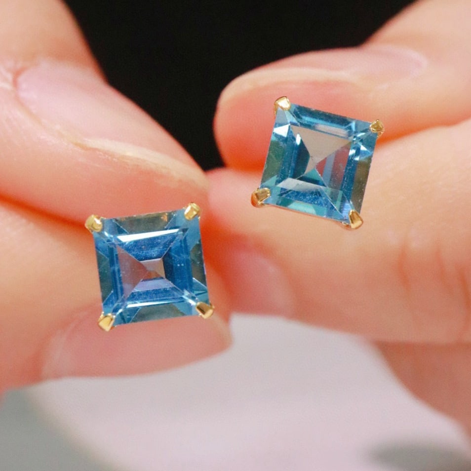 14k Gold 3 Ct Natural Topaz Earrings: Ref:230951091 // gold content:14k gold // main gemstone:topaz // shape:square // carat weight:3ct // color:blue // treatment:natural // Condition: NewLow Estimate: 1300.00High Estimate: 2000.00