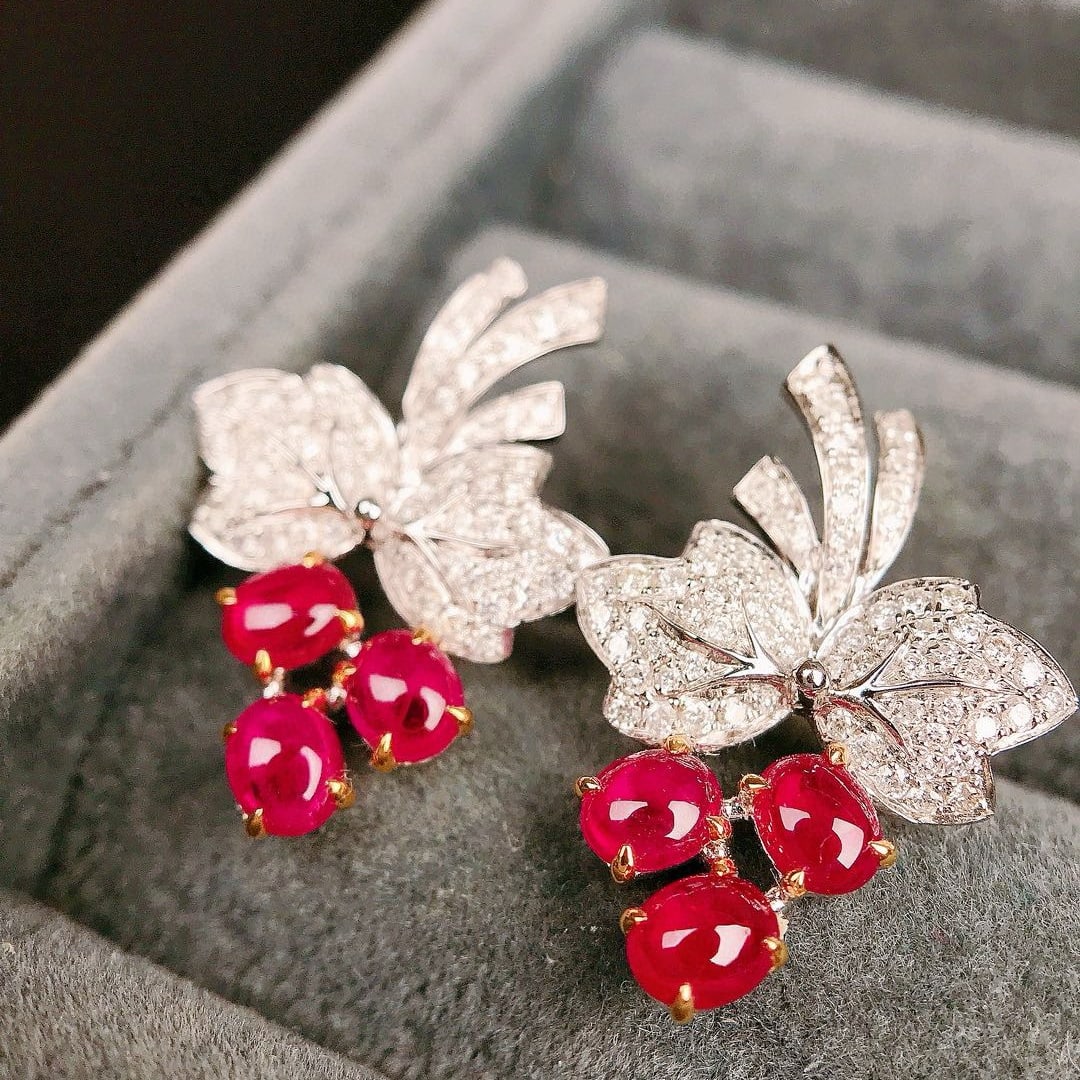 14k Gold 1.83 Ctw Natural Ruby & Diamond Earrings: Ref:230951150 // gold content:14k gold // main gemstone:ruby // shape:oval // carat weight:1. 43ct // color:red // treatment:natural // // adjacent gemstone 2 : diamond // shape:round // carat weight: