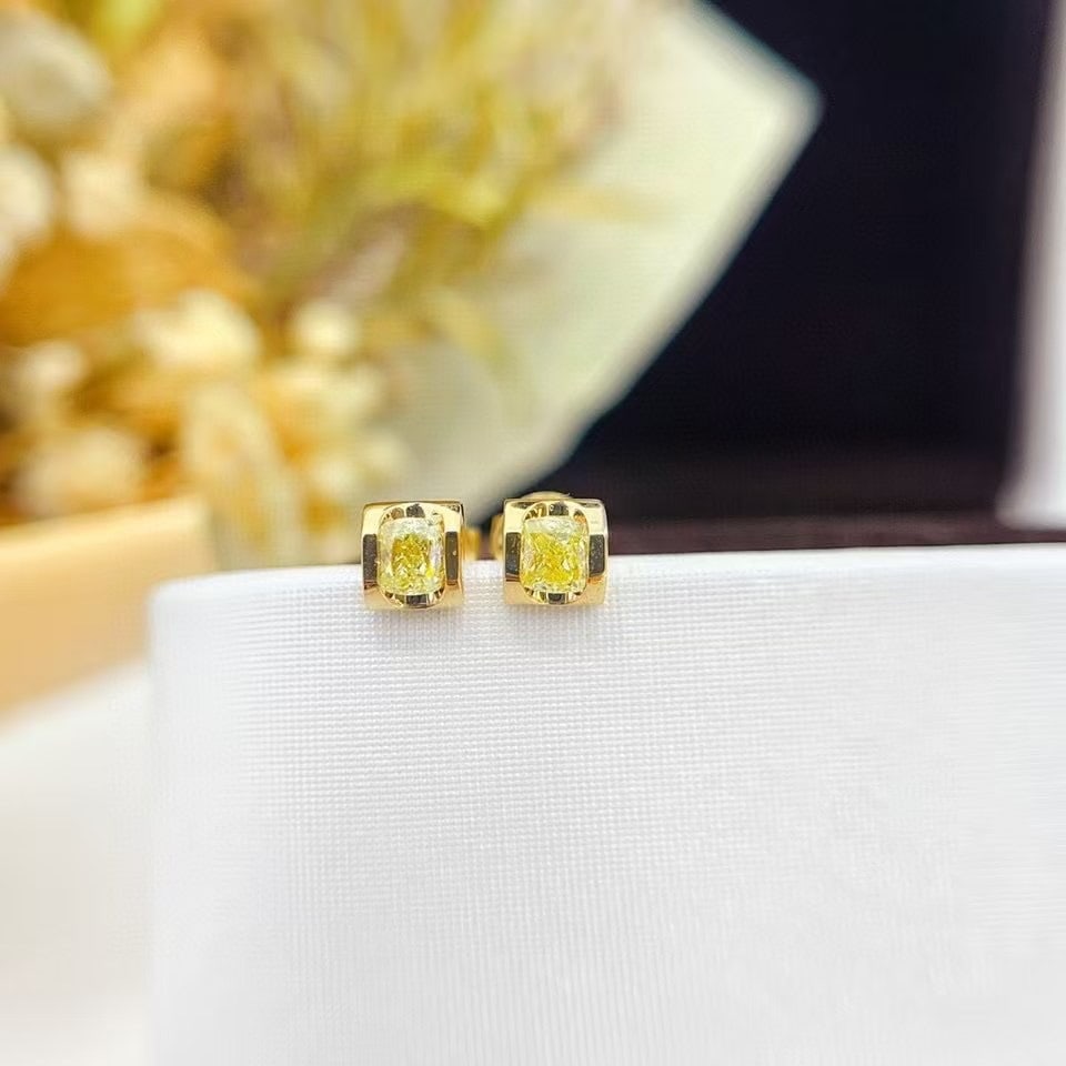 14k Gold 0.32 Ct Natural Yellow Diamond Earrings: Ref:230951243 // gold content:14k gold // main gemstone:yellow diamond // shape:cushion // carat weight:0. 32ct // color:yellow // treatment:natural // Condition: NewLow Estimate: 3500.00High