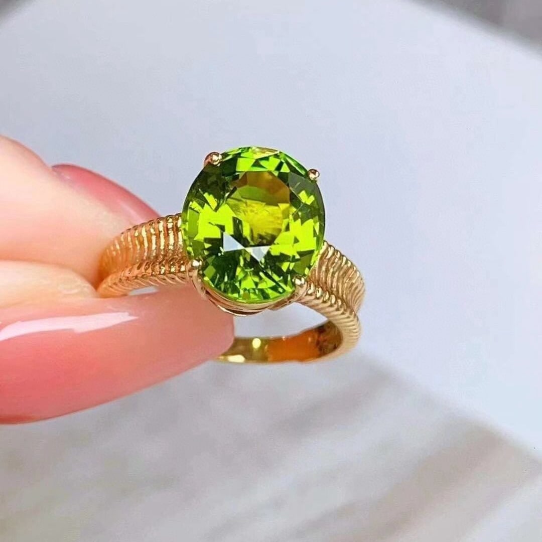 14k Gold 5.20 Ct Natural Tourmaline Ring: Ref:230952174 // gold content:14k gold // ring size:7. 25us // // main gemstone:tourmaline // shape:oval // carat weight:5. 20ct // color:green // treatment:natural // Condition: New Low Estimate: 75