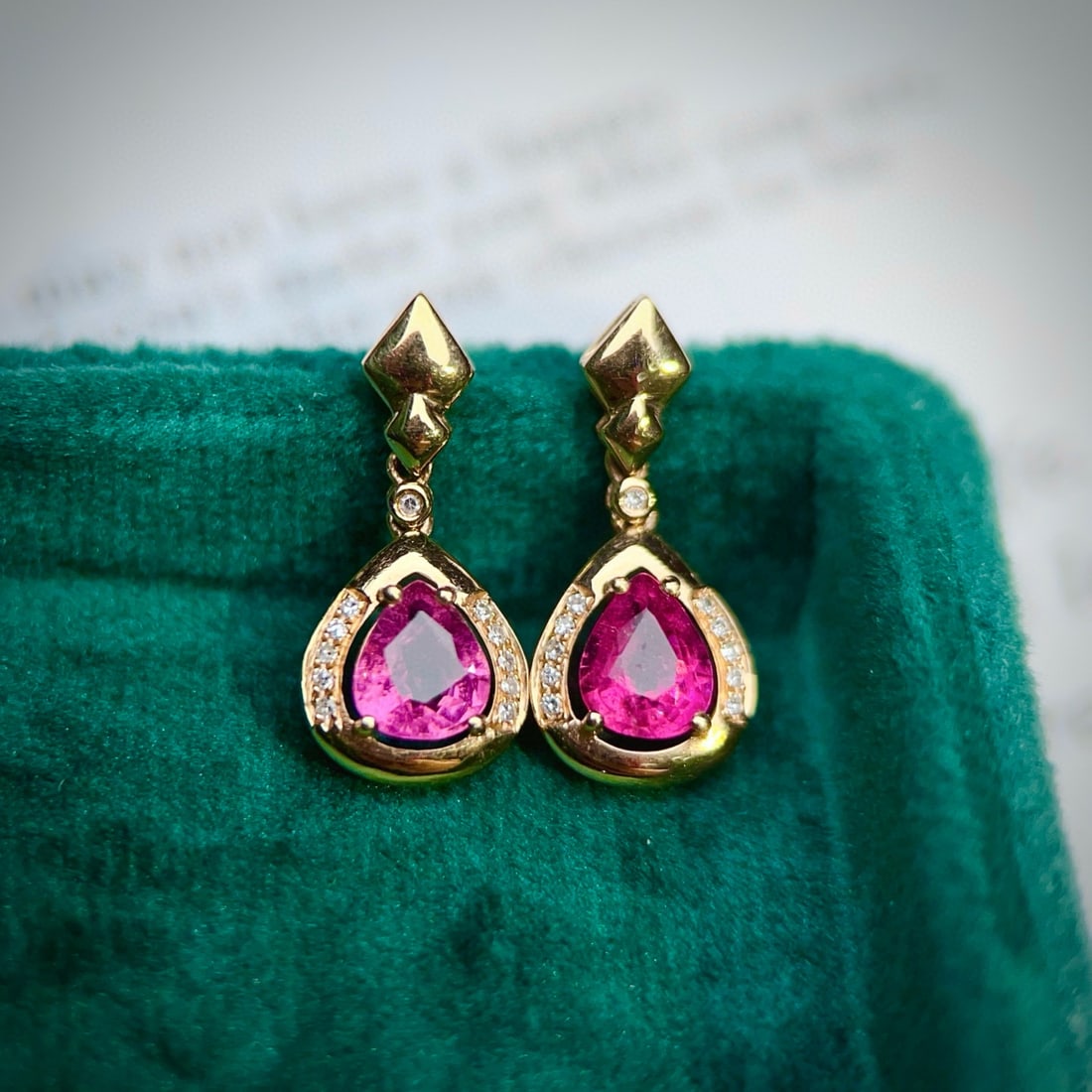 14k Gold 1.27 Ctw Natural Tourmaline & Diamond Earrings: Ref:230953007 // gold content:14k gold // main gemstone:tourmaline // shape:pear // carat weight:1. 2ct // color:red // treatment:natural // // adjacent gemstone 2 : diamond // number of stones:22