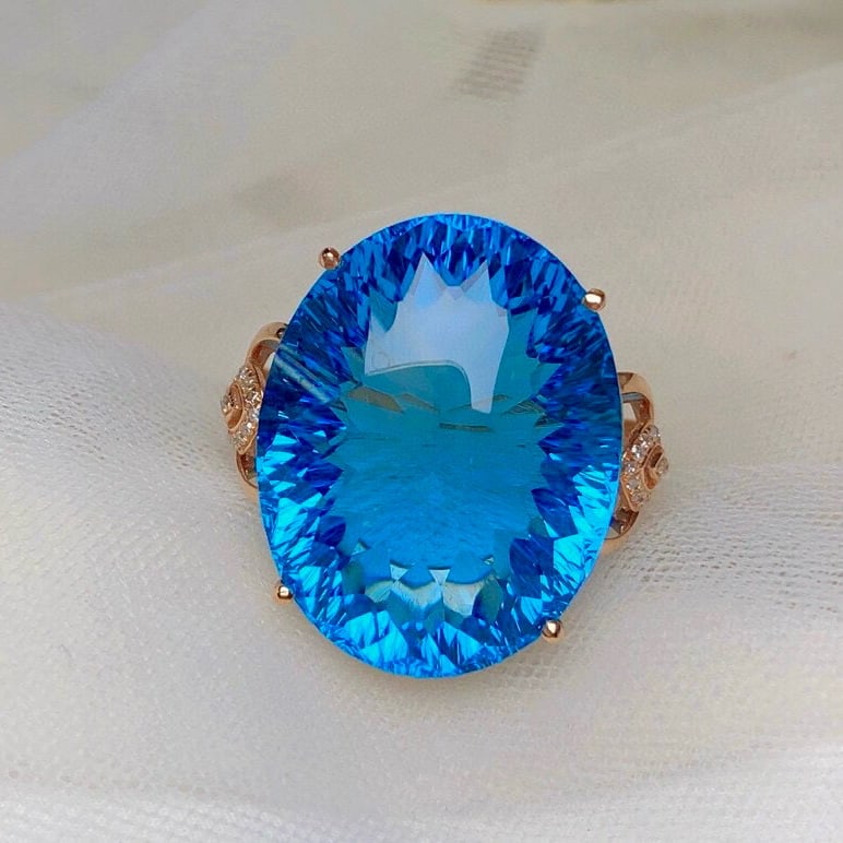 14k Gold 36.90 Ct Natural Topaz & Diamond Ring: Ref:230953022 // gold content:14k gold // ring size:7. 25us // // main gemstone:topaz // shape:oval // carat weight:36. 90ct // color:swiss blue // treatment:natural // // adjacent gemstone 2 :