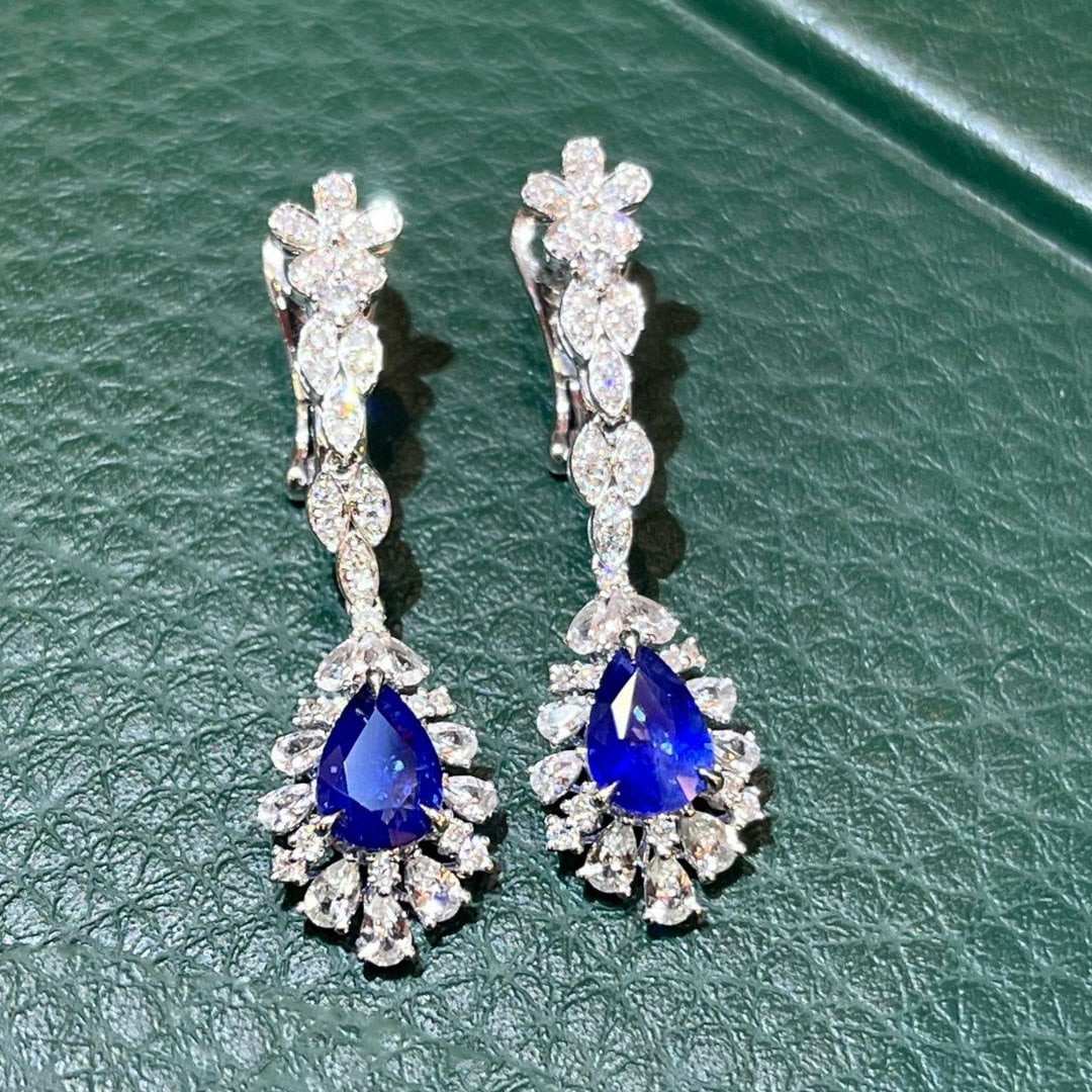 14k Gold 2.87 Ctw Vivid Blue Natural Sapphire & Sapphire Earrings: Ref:230953043 // gold content:14k gold // main gemstone:sapphire // shape:pear // carat weight:1. 93ct // color:vivid blue // treatment:natural // // adjacent gemstone 2 : sapphire // number of stones