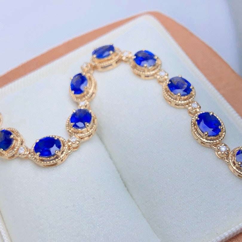 14k Gold 5.51 Ctw Natural Sapphire & Diamond Bracelet: Ref:230953127 // gold content:14k gold // main gemstone:sapphire // shape:oval // carat weight:5. 39ct // color:royal blue // treatment:natural // // adjacent gemstone 2 : diamond // shape:round // ca