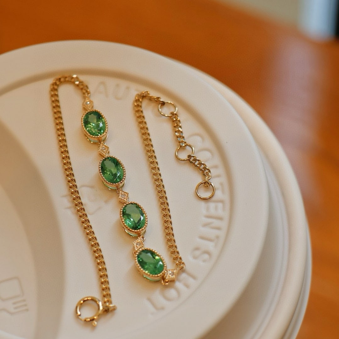 14k Gold 1.5 Ct Natural Tsavorite & Diamond Bracelet: Ref:230953199 // gold content:14k gold // main gemstone:tsavorite // shape:oval // carat weight:1. 5ct // color:green // treatment:natural // // adjacent gemstone 2 : diamond // shape:round //