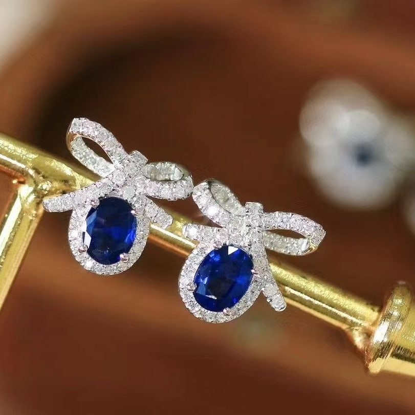 14k Gold 1.35 Ctw Natural Sapphire & Diamond Earrings: Ref:230953220 // gold content:14k gold // main gemstone:sapphire // shape:oval // carat weight:1ct // color:royal blue // treatment:natural // // adjacent gemstone 2 : diamond // shape:round //