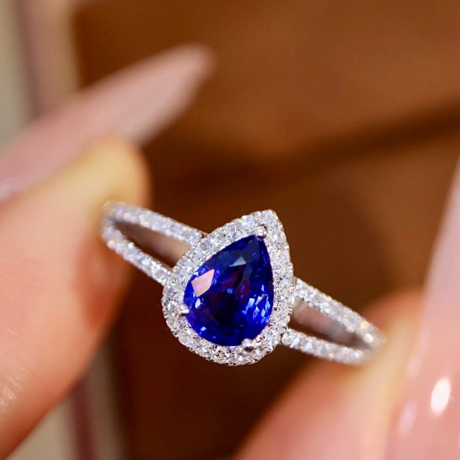 14k Gold 0.89 Ctw Vivid Blue Natural Sapphire & Diamond Ring: Ref:230954002 // gold content:14k gold // ring size:7. 25us // // main gemstone:sapphire // shape:pear // carat weight:0. 72ct // color:vivid blue // treatment:natural // // adjacent gemstone 2 :