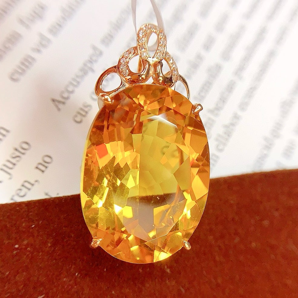 14k Gold 26.85 Ct Natural Citrine & Diamond Pendant( Without Chain ): Ref:230954194 // gold content:14k gold // main gemstone:citrine // shape:oval // carat weight:26. 85ct // color:yellow // treatment:natural // // adjacent gemstone 2 : diamond // number of stones:21 /