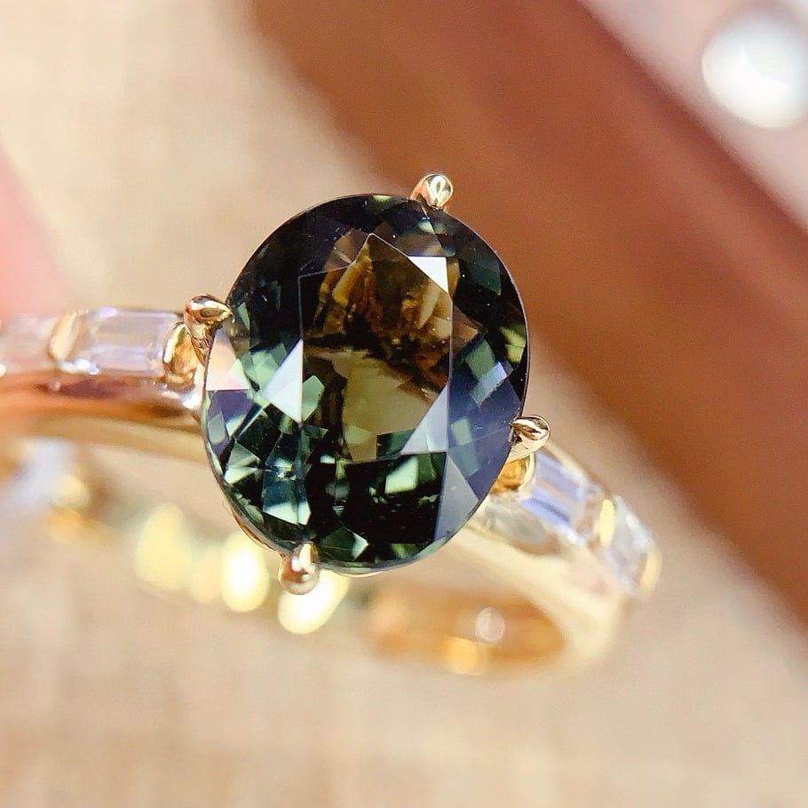 14k Gold 2.7 Ct Natural Tourmaline & Sapphire Ring: Ref:230954210 // gold content:14k gold // ring size:7. 25us // // main gemstone:tourmaline // shape:oval // carat weight:2. 7ct // color:green // treatment:natural // // adjacent gemstone 2 :