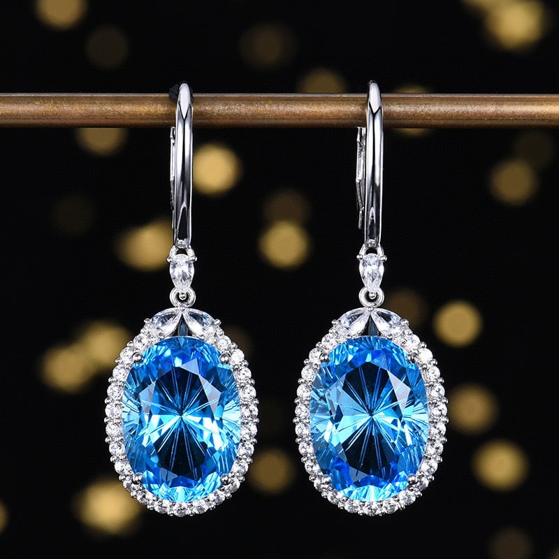 14k Gold 15.19 Ctw Natural Topaz & Sapphire Earrings: Ref:230954388 // gold content:14k gold // main gemstone:topaz // shape:oval // carat weight:14ct // color:swiss blue // treatment:natural // // adjacent gemstone 2 : sapphire // shape:multiply // cara
