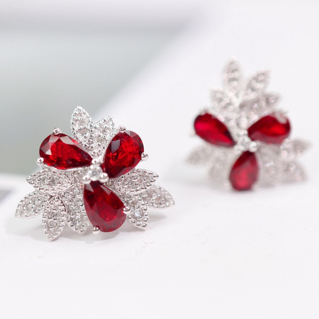 14k Gold 1.79 Ctw Natural Ruby & Diamond Earrings: Ref:230954424 // gold content:14k gold // main gemstone:ruby // shape:pear // carat weight:1. 65ct // color:pigeonblood red // treatment:natural // // adjacent gemstone 2 : diamond // shape:round
