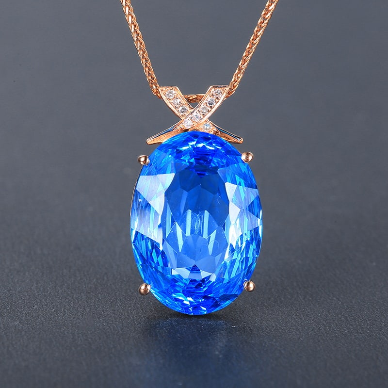 14k Gold 9.90 Ctw Natural Topaz & Diamond Pendant( Without Chain ): Ref:230955104 // gold content:14k gold // main gemstone:topaz // shape:oval // carat weight:9. 88ct // color:blue // treatment:natural // // adjacent gemstone 2 : diamond // number of stones:9 //