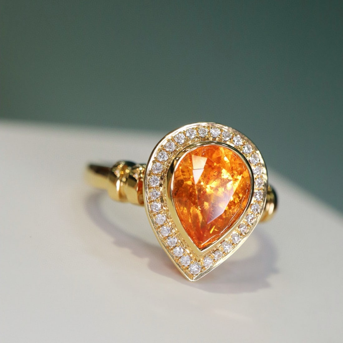 14k Gold 2.23 Ct Natural Spessartine & Diamond Ring: Ref:230955134 // gold content:14k gold // ring size:7. 25us // // main gemstone:spessartine // shape:pear // carat weight:2. 23ct // color:orange // treatment:natural // // adjacent gemstone 2 : diamo