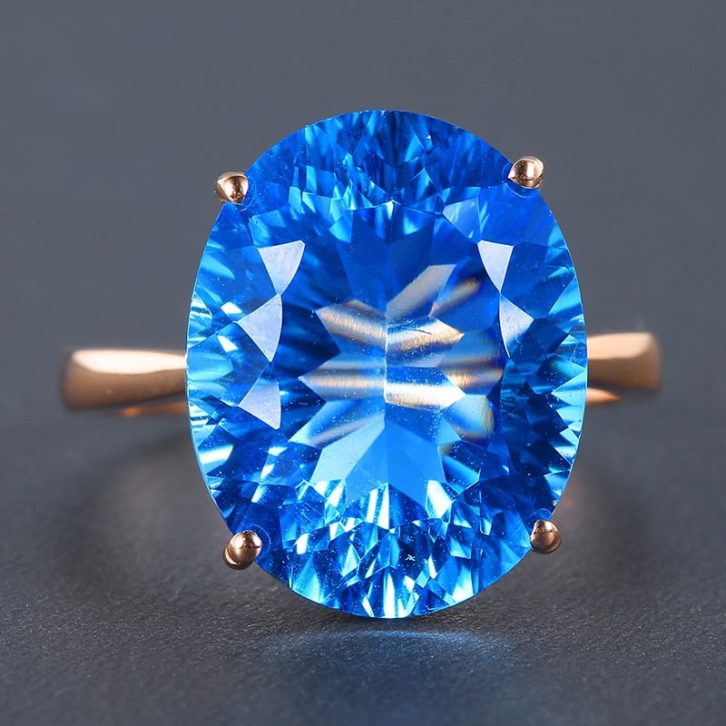14k Gold 12.02 Ct Natural Topaz Ring: Ref:230955142 // gold content:14k gold // ring size:7. 25us // // main gemstone:topaz // shape:oval // carat weight:12. 02ct // color:swiss blue // treatment:natural // Condition: NewLow Estimate: