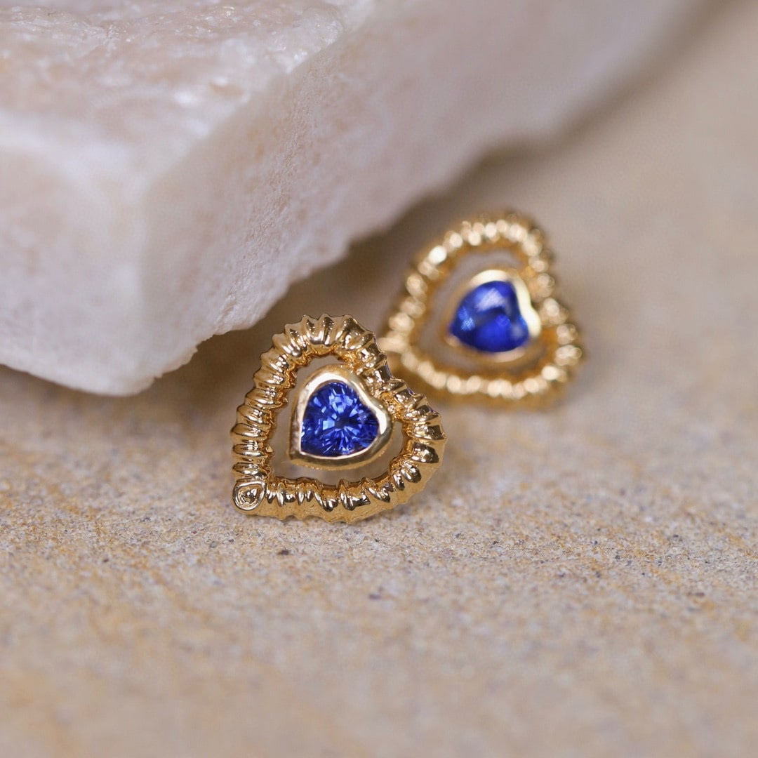 14k Gold 0.93 Ct Natural Sapphire Earrings: Ref:230955162 // gold content:14k gold // main gemstone:sapphire // shape:heart // carat weight:0. 93ct // color:blue // treatment:natural // Condition: NewLow Estimate: 1700.00High Estimate: 2500.00