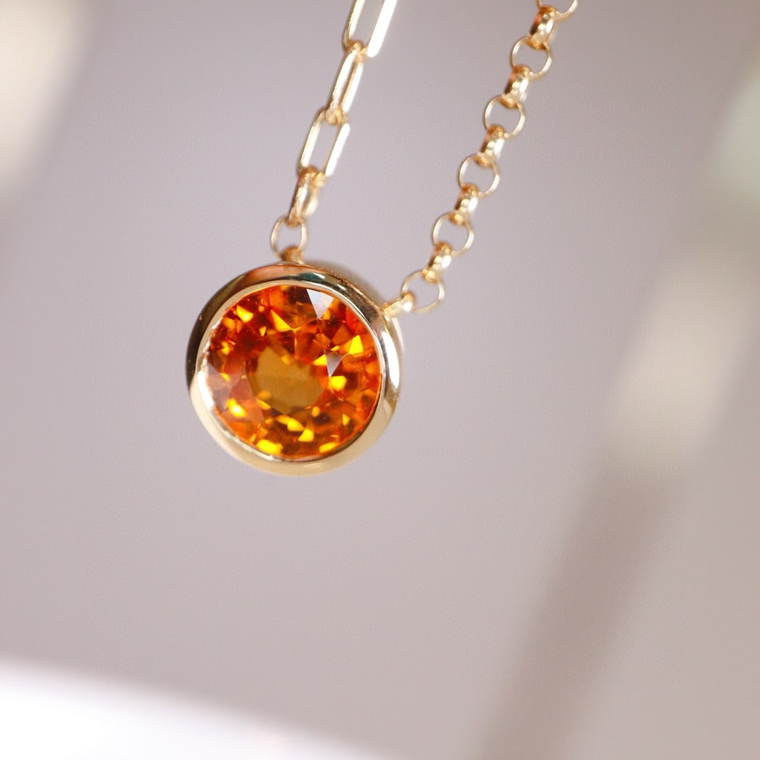 14k Gold 1 Ct Natural Spessartine Necklace: Ref:230955219 // gold content:14k gold // main gemstone:spessartine // shape:round // carat weight:1ct // color:orange // treatment:natural // cut grade:g // Condition: New Low Estimate: 2400.00 High