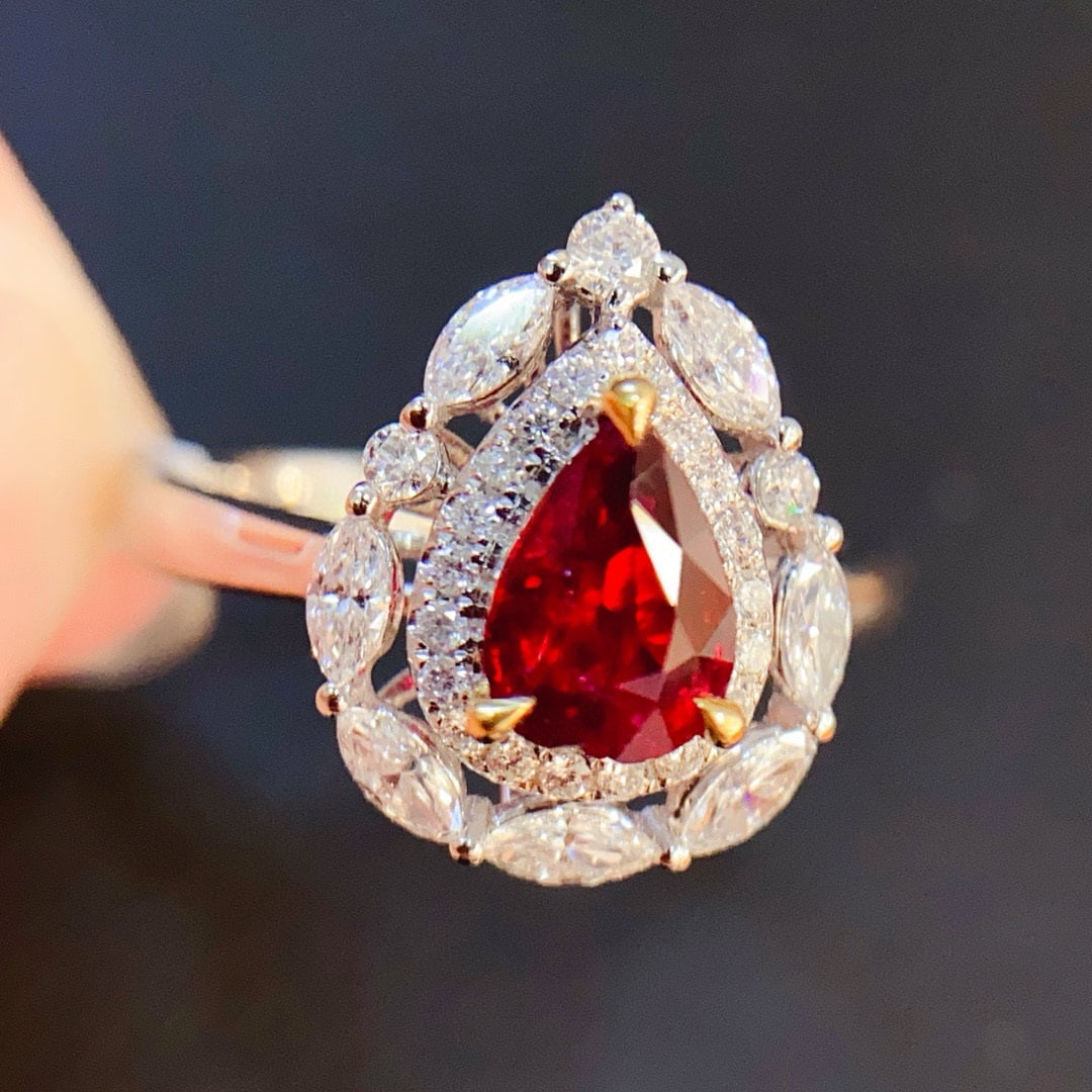 14k Gold 1.53 Ctw Vivid Red Natural Ruby & Diamond Ring: Ref:230955245 // gold content:14k gold // ring size:7. 25us // // main gemstone:ruby // shape:pear // carat weight:1. 02ct // color:vivid red // treatment:natural // // adjacent gemstone 2 : diamond /