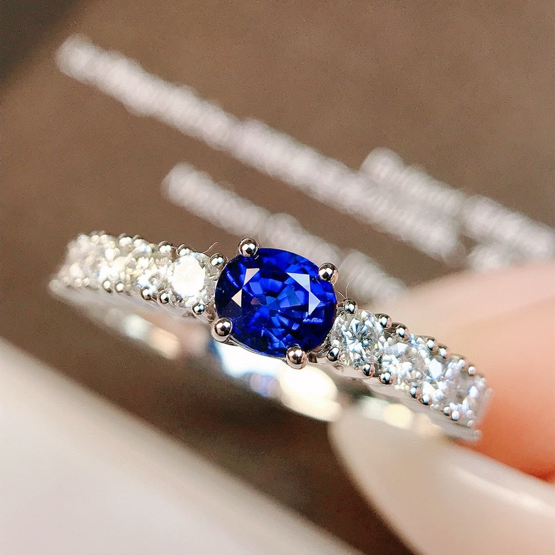 14k Gold 0.89 Ctw Vivid Blue Natural Sapphire & Diamond Ring: Ref:230956018 // gold content:14k gold // ring size:7. 25us // // main gemstone:sapphire // shape:oval // carat weight:0. 49ct // color:vivid blue // treatment:natural // // adjacent gemstone 2 : diam