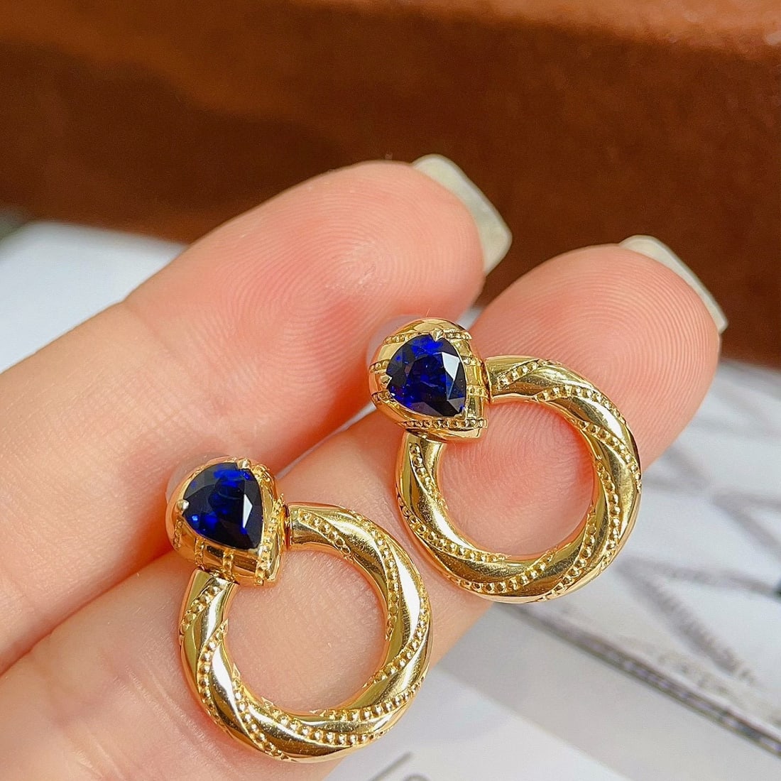 14k Gold 1.3 Ct Natural Sapphire Earrings: Ref:230956116 // gold content:14k gold // main gemstone:sapphire // shape:pear // carat weight:1. 3ct // color:royal blue // treatment:natural // Condition: NewLow Estimate: 5100.00High Estimate: