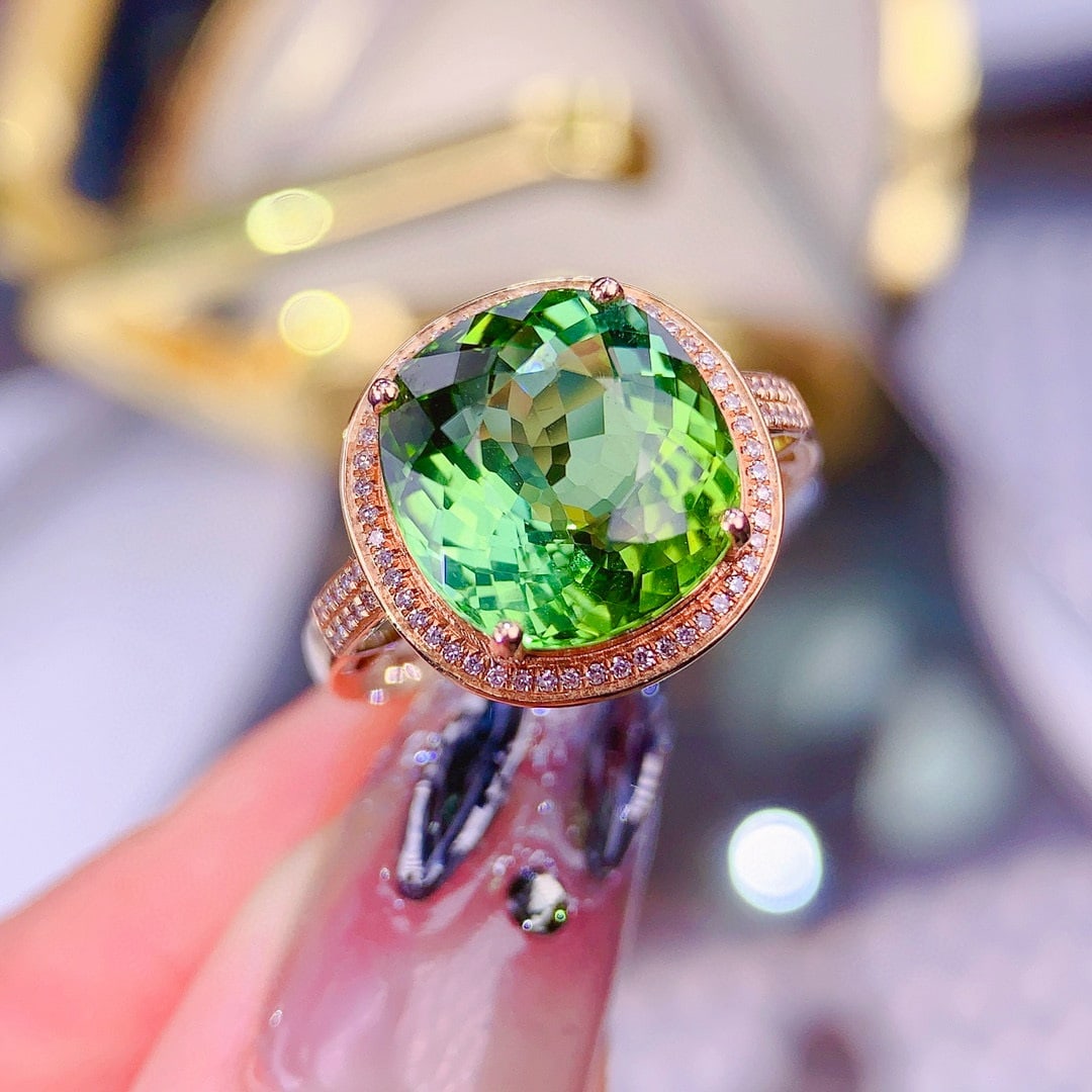 14k Gold 6.5 Ct Natural Tourmaline & Diamond Ring: Ref:230956412 // gold content:14k gold // ring size:7. 25us // // main gemstone:tourmaline // shape:oval // carat weight:6. 5ct // color:green // treatment:natural // // adjacent gemstone 2 :
