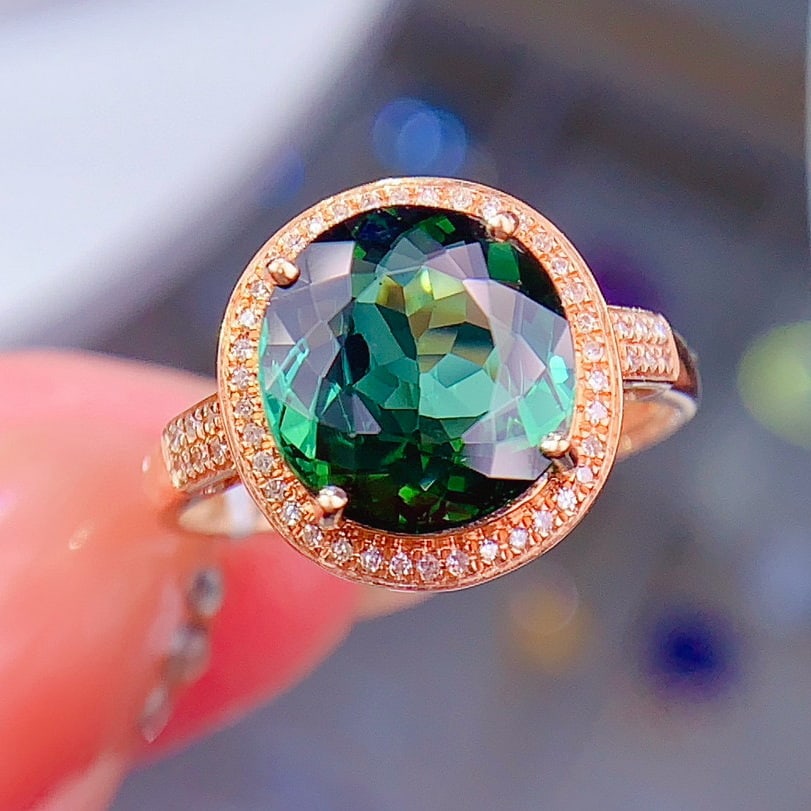 14k Gold 4.24 Ctw Natural Tourmaline & Diamond Ring: Ref:230956417 // gold content:14k gold // ring size:7. 25us // // main gemstone:tourmaline // shape:oval // carat weight:4. 2ct // color:green // treatment:natural // // adjacent gemstone 2 :