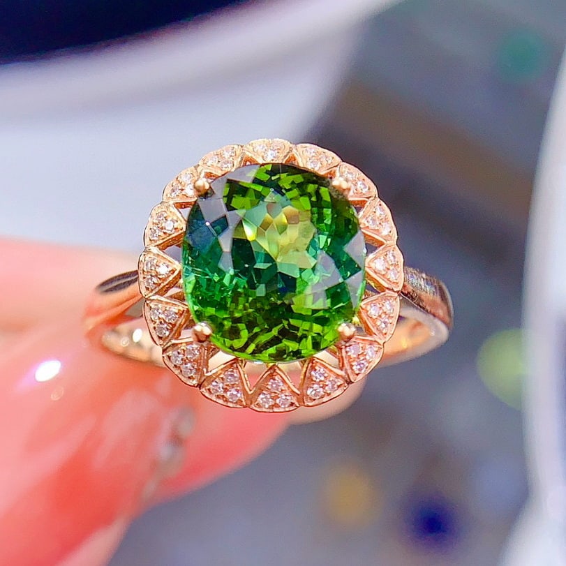14k Gold 3.5 Ct Natural Tourmaline & Diamond Ring: Ref:230956432 // gold content:14k gold // ring size:7. 25us // // main gemstone:tourmaline // shape:oval // carat weight:3. 5ct // color:green // treatment:natural // // adjacent gemstone 2 :