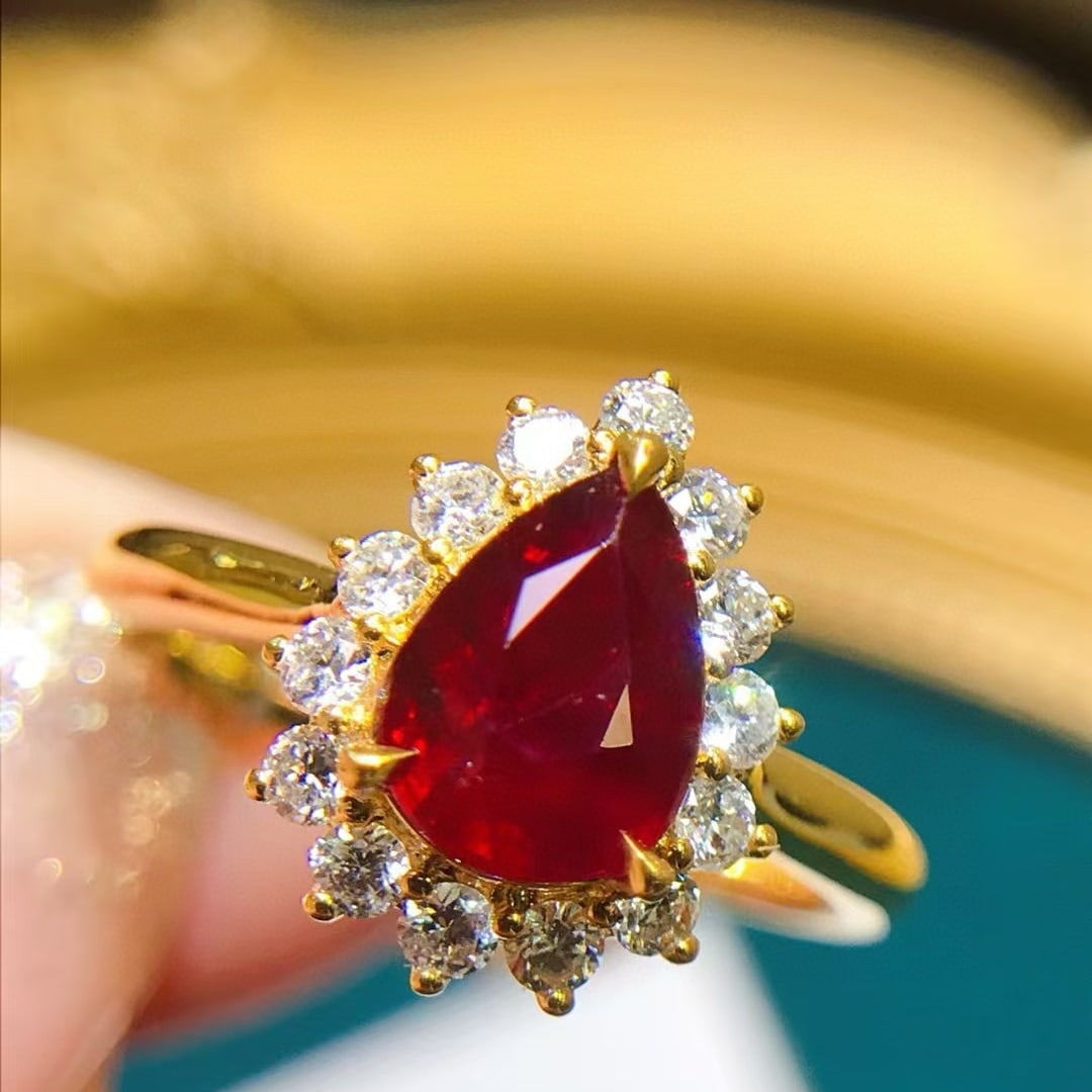 14k Gold 2.12 Ctw Natural Ruby & Diamond Ring: Ref:230957187 // gold content:14k gold // ring size:7. 25us // // main gemstone:ruby // shape:pear // carat weight:1. 6ct // color:pigeonblood red // treatment:natural // // adjacent gemstone 2 :