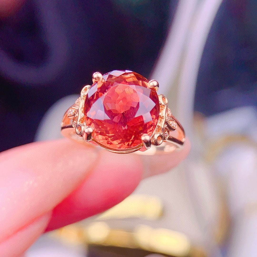 14k Gold 5.8 Ct Natural Tourmaline & Diamond Ring: Ref:230957199 // gold content:14k gold // ring size:7. 25us // // main gemstone:tourmaline // shape:oval // carat weight:5. 8ct // color:orange // treatment:natural // // adjacent gemstone 2 : diamond