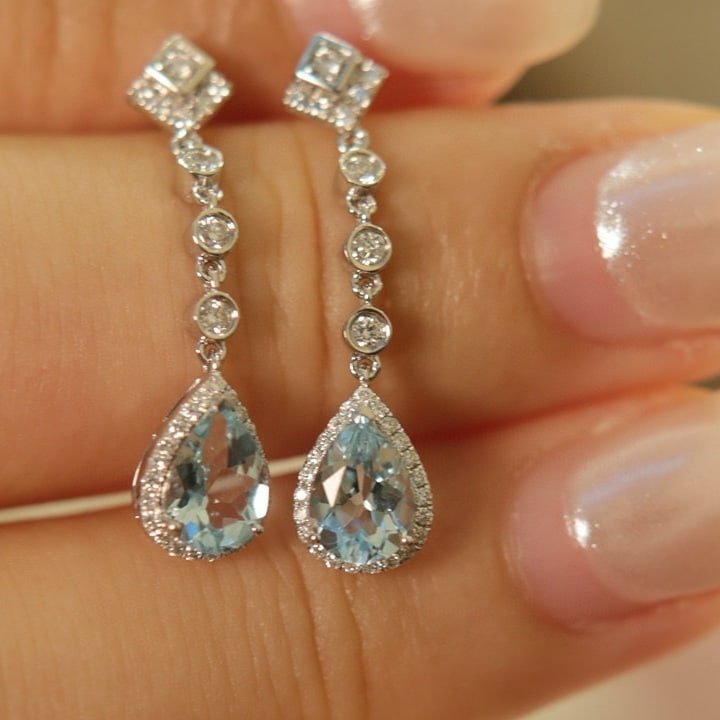 14k Gold 1.48 Ct Natural Aquamarine & Diamond Earrings: Ref:230957212 // gold content:14k gold // main gemstone:aquamarine // shape:pear // carat weight:1. 48ct // color:santa maria color // treatment:natural // // adjacent gemstone 2 : diamond //