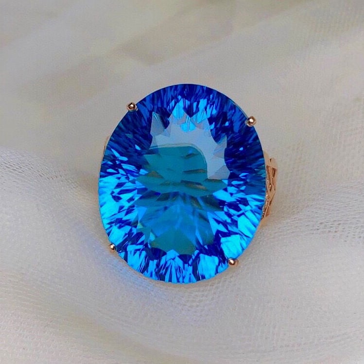 14k Gold 25.20 Ct Natural Topaz & Diamond Ring: Ref:230957256 // gold content:14k gold // ring size:7. 25us // // main gemstone:topaz // shape:oval // carat weight:25. 20ct // color:blue // treatment:natural // // adjacent gemstone 2 : diamond