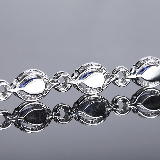 14k Gold 3.91 Ctw Natural Sapphire & Diamond Bracelet: Ref:230958239 // gold content:14k gold // main gemstone:sapphire // shape:pear // carat weight:3. 48ct // color:cornflower blue // treatment:natural // // adjacent gemstone 2 : diamond // number of