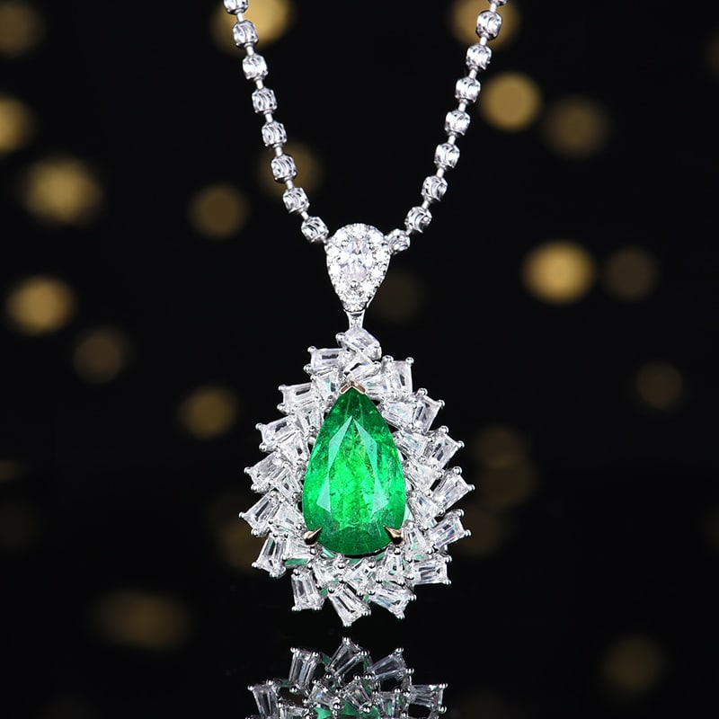 14k Gold 3.09 Ctw Vivid Green Natural Emerald & Sapphire Pendant( Without Chain ): Ref:230958281 // gold content:14k gold // main gemstone:emerald // shape:pear // carat weight:1. 85ct // color:vivid green // treatment:natural // // adjacent gemstone 2 : sapphire // number of stones