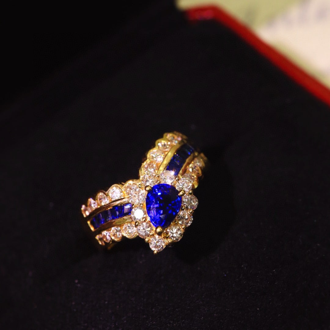 14k Gold 1.47 Ctw Natural Sapphire & Diamond Ring: Ref:230958348 // gold content:14k gold // ring size:7. 25us // // main gemstone:sapphire // shape:pear // carat weight:0. 7ct // color:royal blue // treatment:natural // // adjacent gemstone 2 : diamo