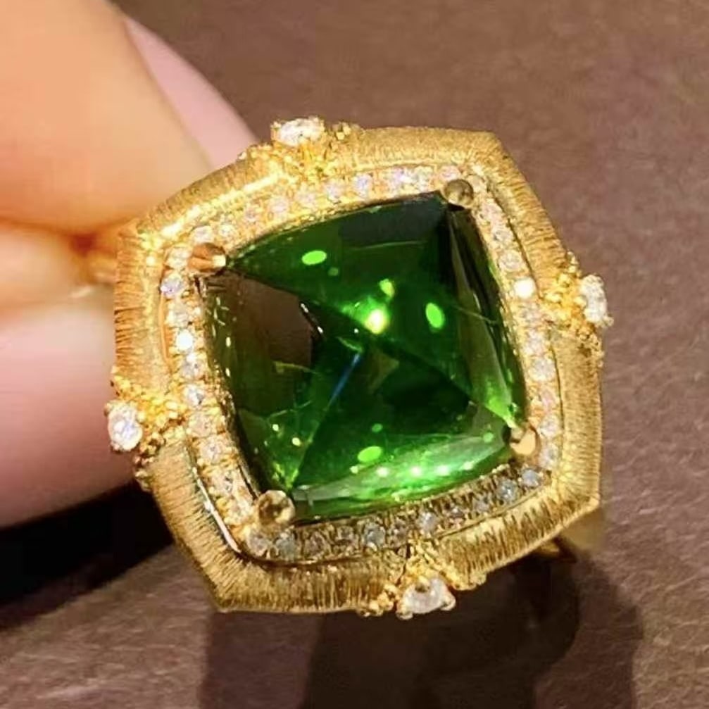 14k Gold 4.85 Ct Natural Tourmaline & Diamond Ring: Ref:231059054 // gold content:14k gold // ring size:7. 25us // // main gemstone:tourmaline // shape:sugar-loaf // carat weight:4. 85ct // color:green // treatment:natural // // adjacent gemstone 2