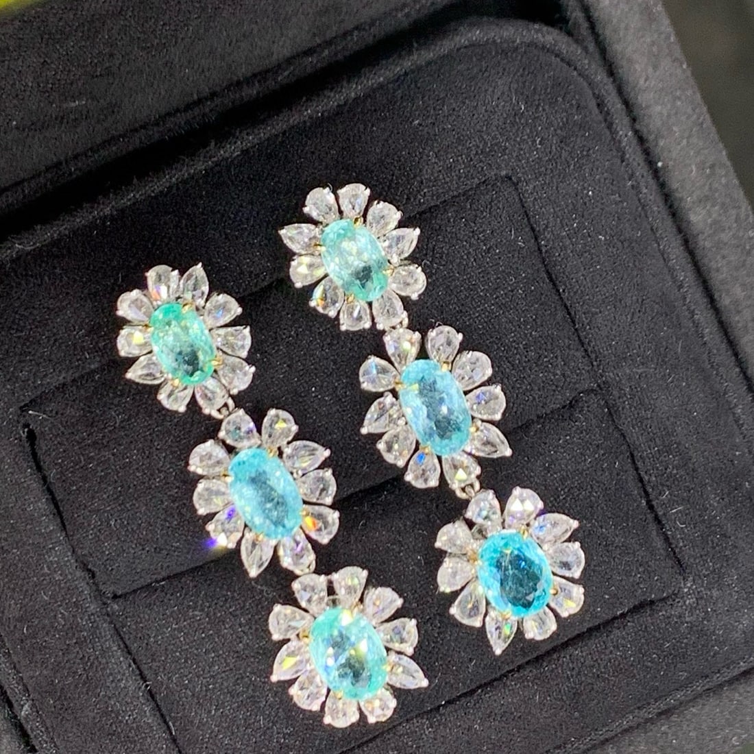 14k Gold 7.97 Ctw Natural Paraiba Tourmaline & Diamond Earrings: Ref:231060019 // gold content:14k gold // main gemstone:paraiba tourmaline // shape:oval // carat weight:5. 12ct // color:blue // treatment:natural // // adjacent gemstone 2 : diamond // shape:pear //