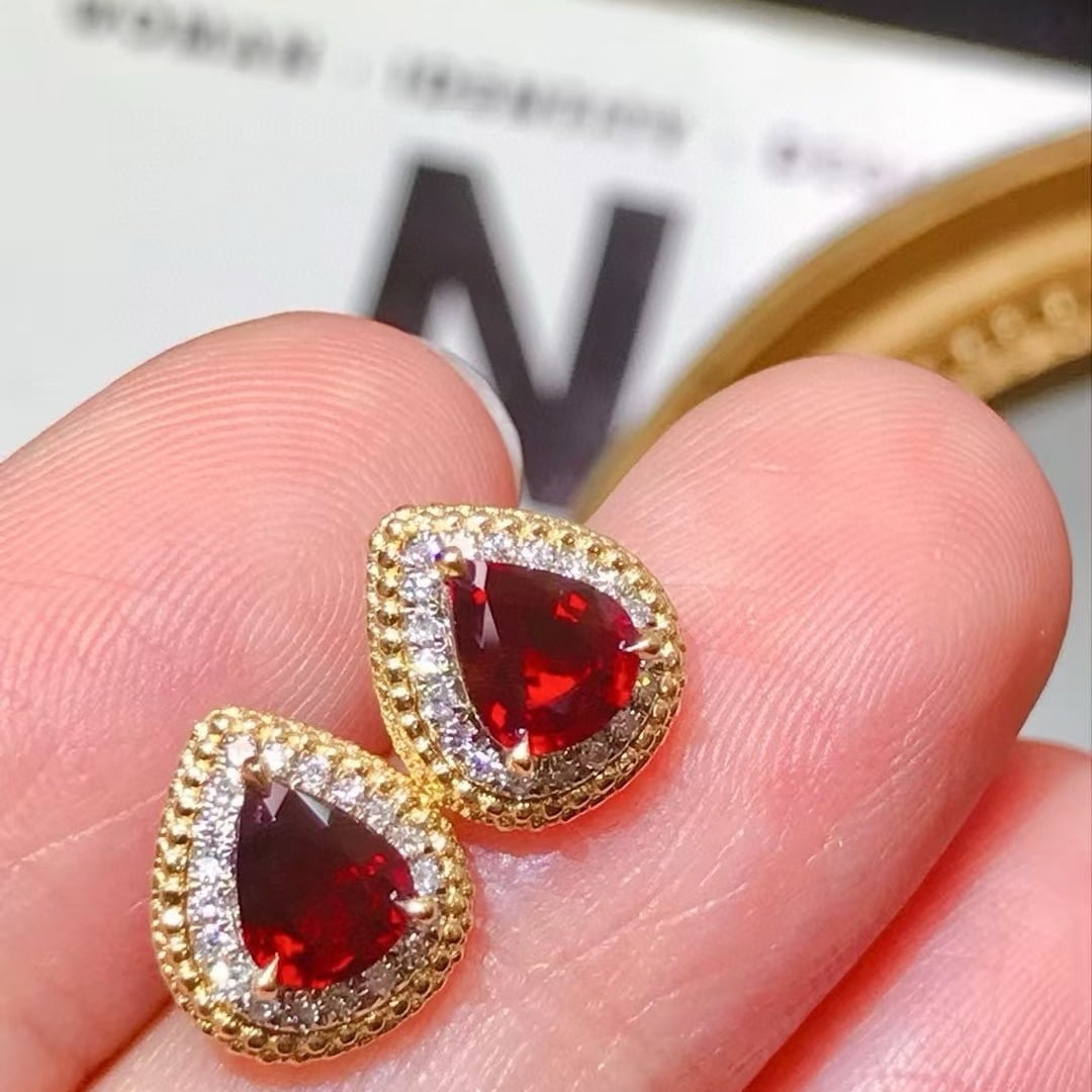14k Gold 1.59 Ctw Natural Ruby & Diamond Earrings: Ref:231060419 // gold content:14k gold // main gemstone:ruby // shape:pear // carat weight:1. 3ct // color:pigeonblood red // treatment:natural // // adjacent gemstone 2 : diamond // shape:round //
