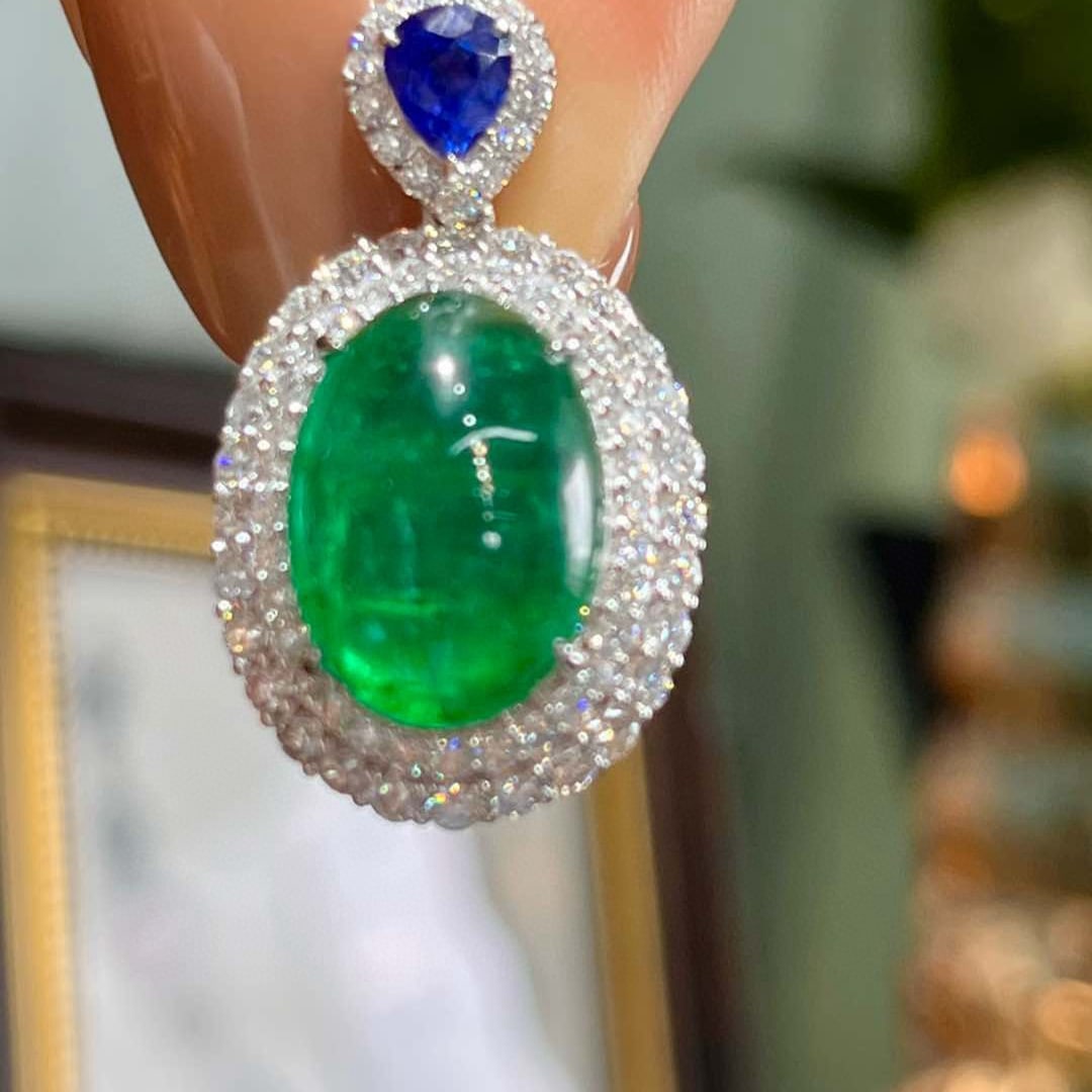 14k Gold 8.83 Ctw Natural Emerald & Sapphire Pendant( Without Chain ): Ref:231060428 // gold content:14k gold // main gemstone:emerald // shape:oval // carat weight:8. 18ct // color:green // treatment:natural // // adjacent gemstone 2 : sapphire // shape:pear // carat