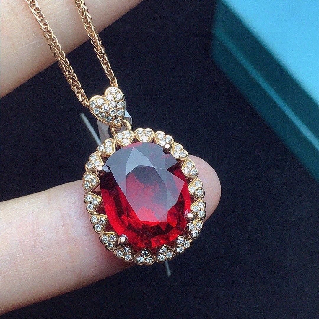 14k Gold 4.24 Ct Natural Tourmaline & Diamond Pendant( Without Chain ): Ref:231061051 // gold content:14k gold // main gemstone:tourmaline // shape:oval // carat weight:4. 24ct // color:red // treatment:natural // // adjacent gemstone 2 : diamond // number of stones:68 //